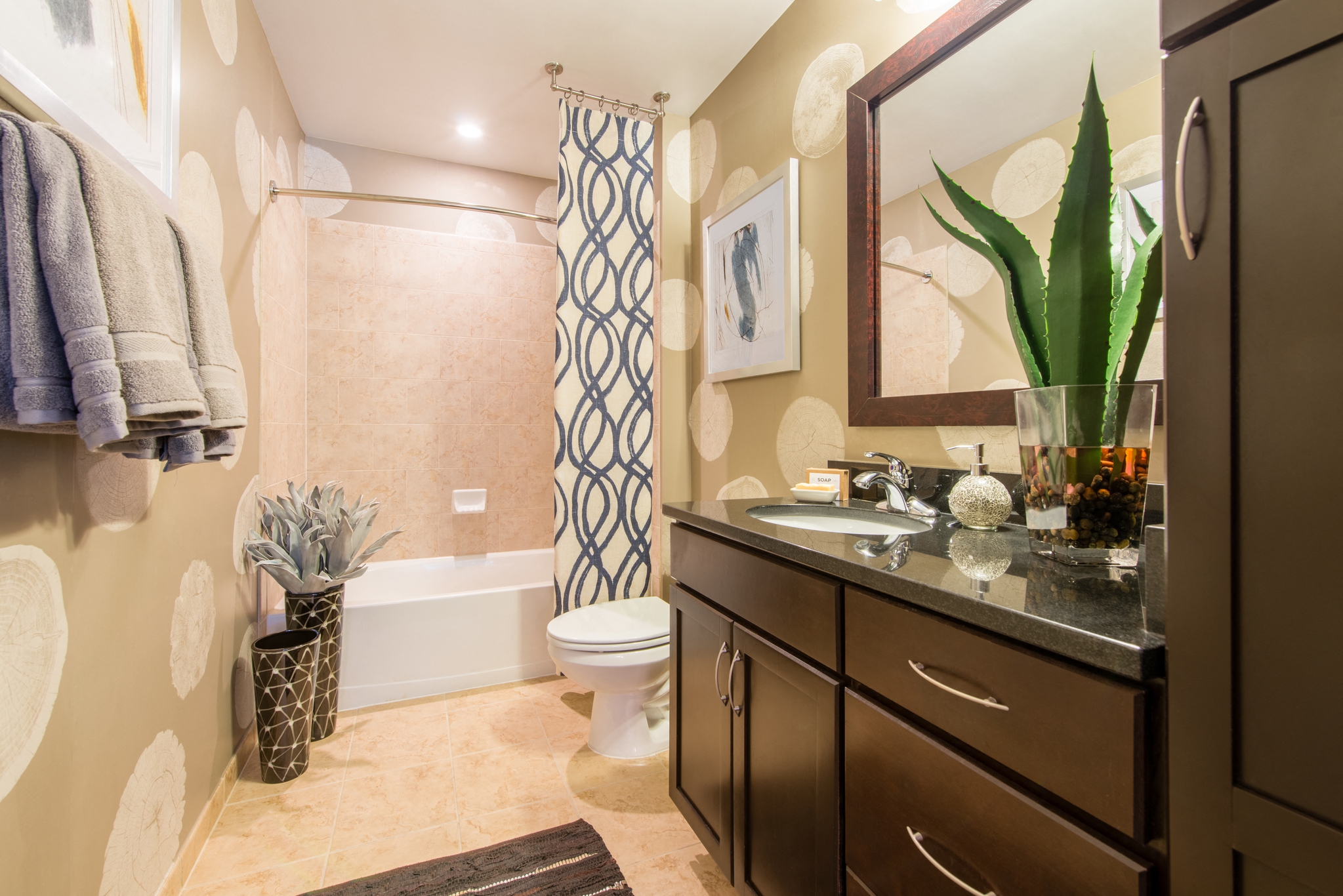 a bathroom with a sink and a toilet and a shower