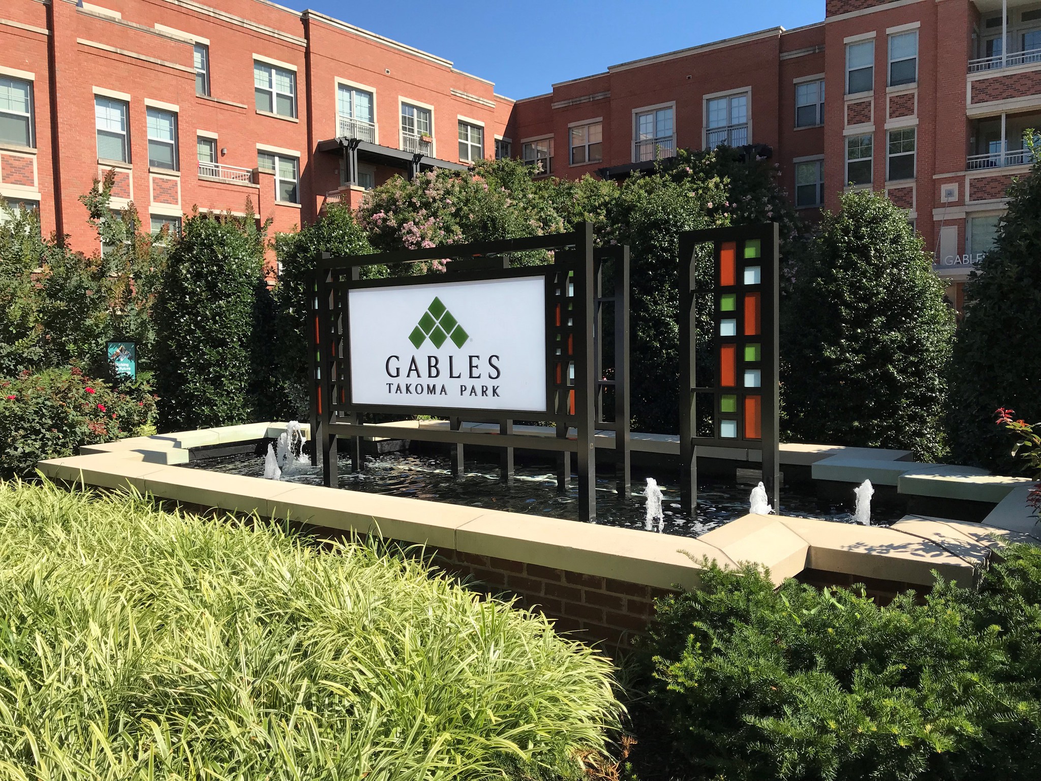 the fountains in front of the gates hospital park sign