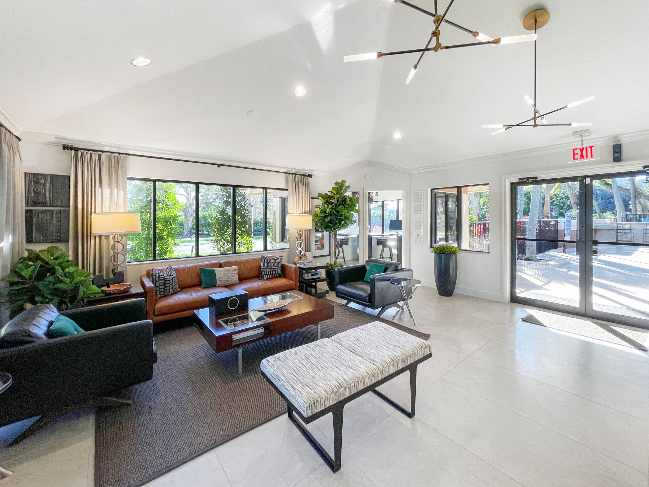 a living room with couches and chairs and a table