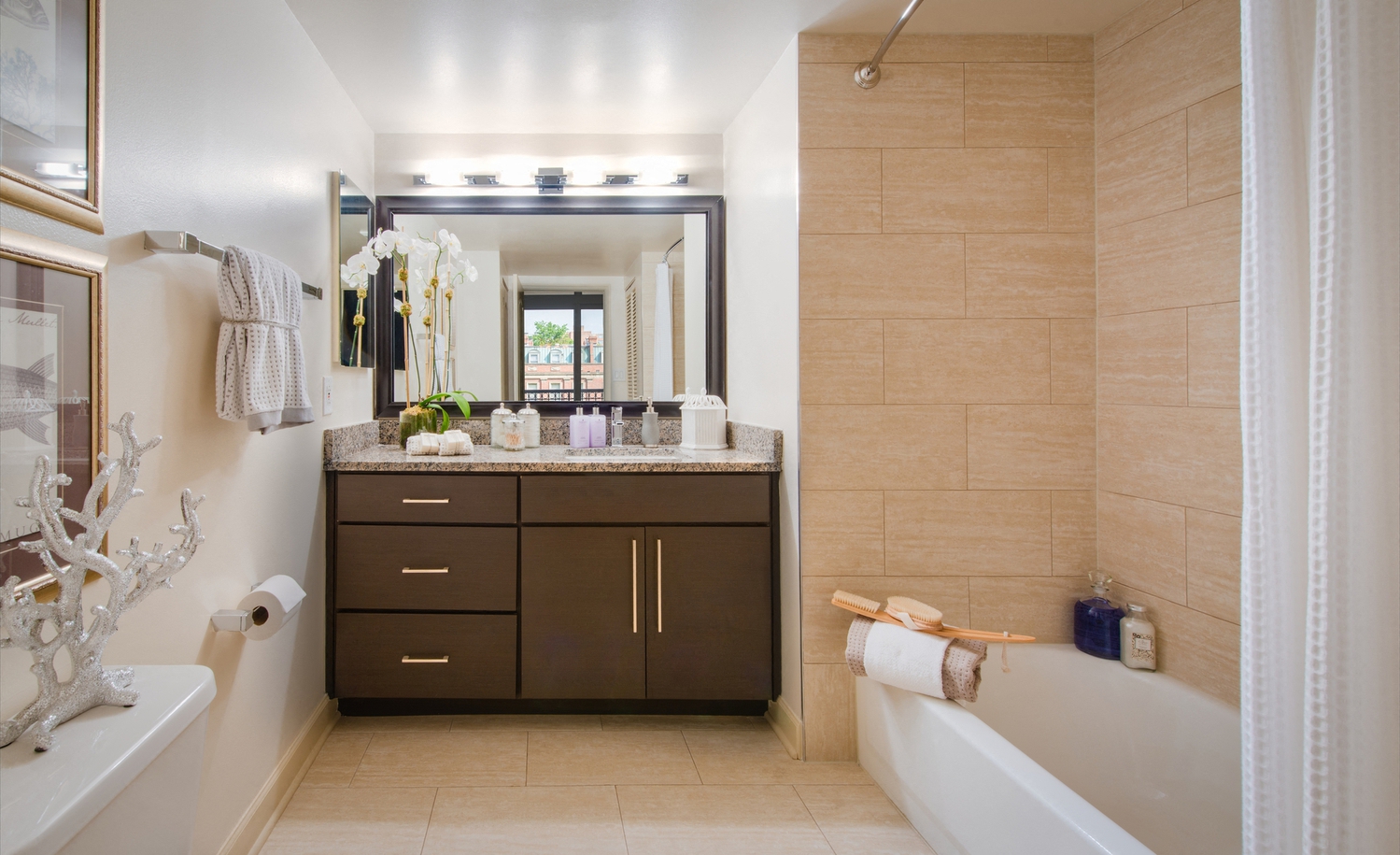 a bathroom with a sink and a tub and a mirror