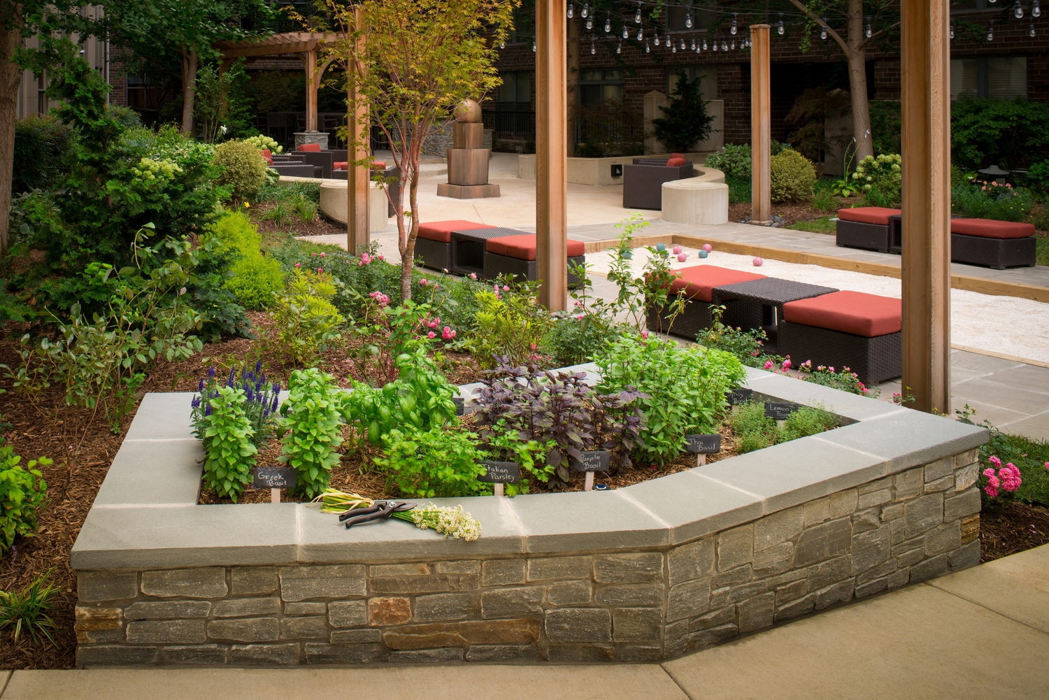 a garden in the middle of a sidewalk