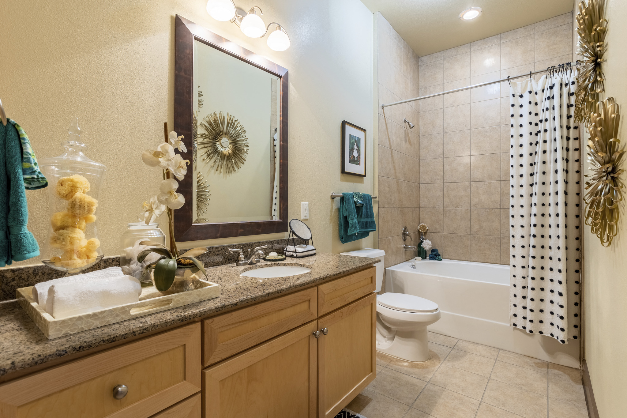 a bathroom with a sink and a toilet and a shower