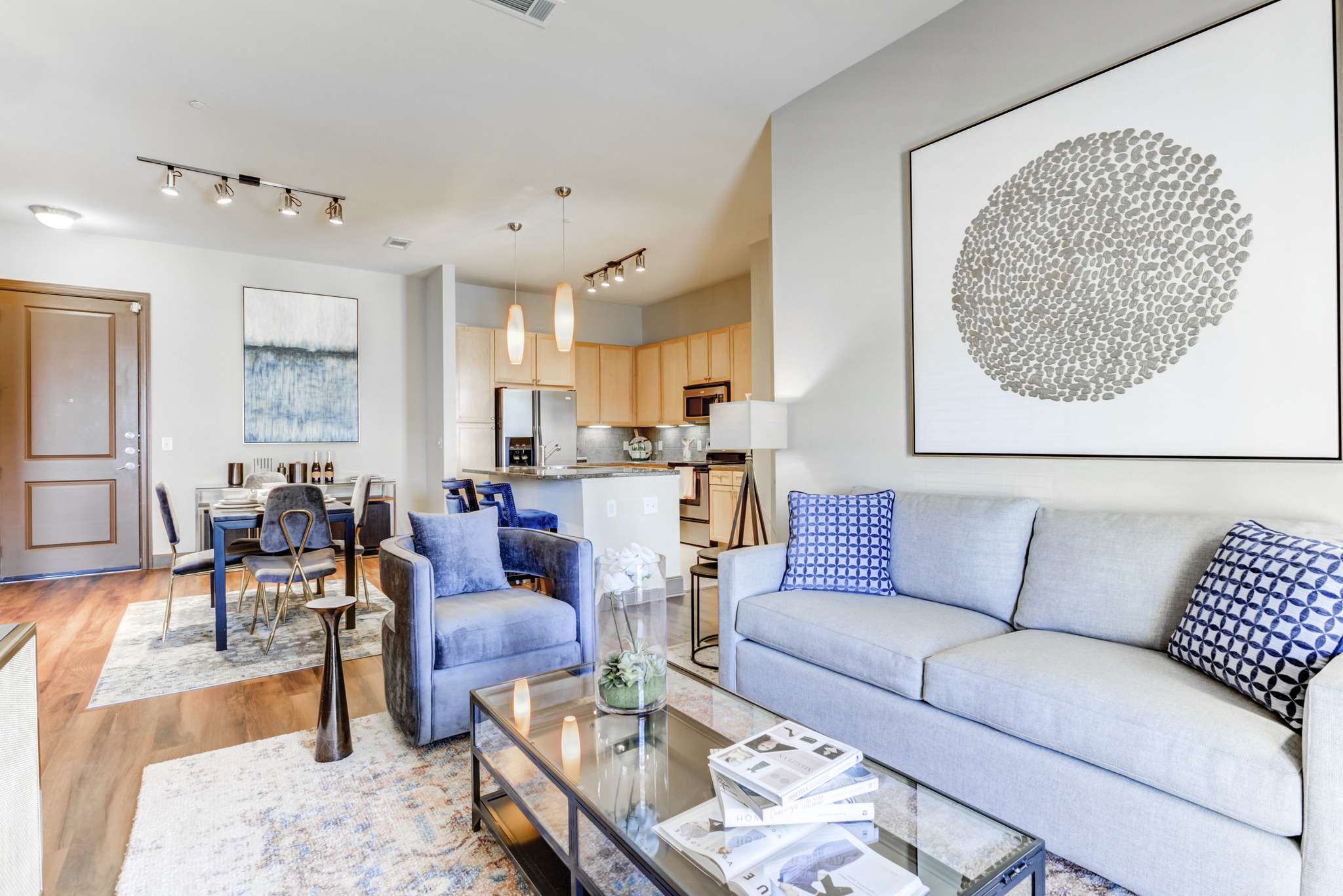 a living room with a couch and a glass coffee table