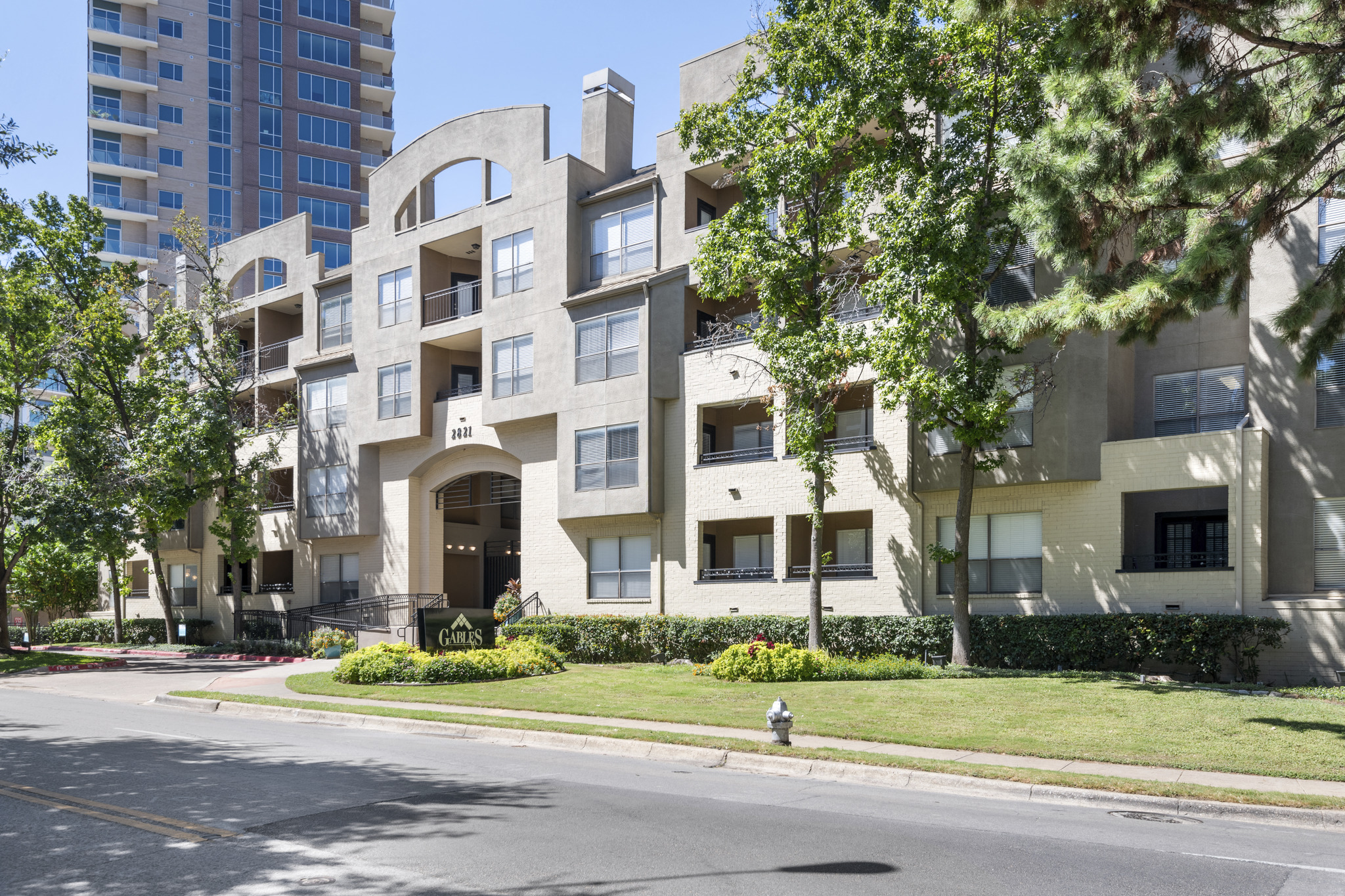 an apartment building on the corner of a street