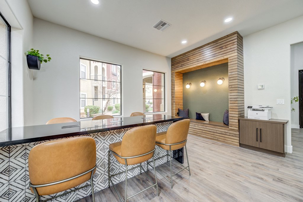 a conference room with a table and chairs and a large window