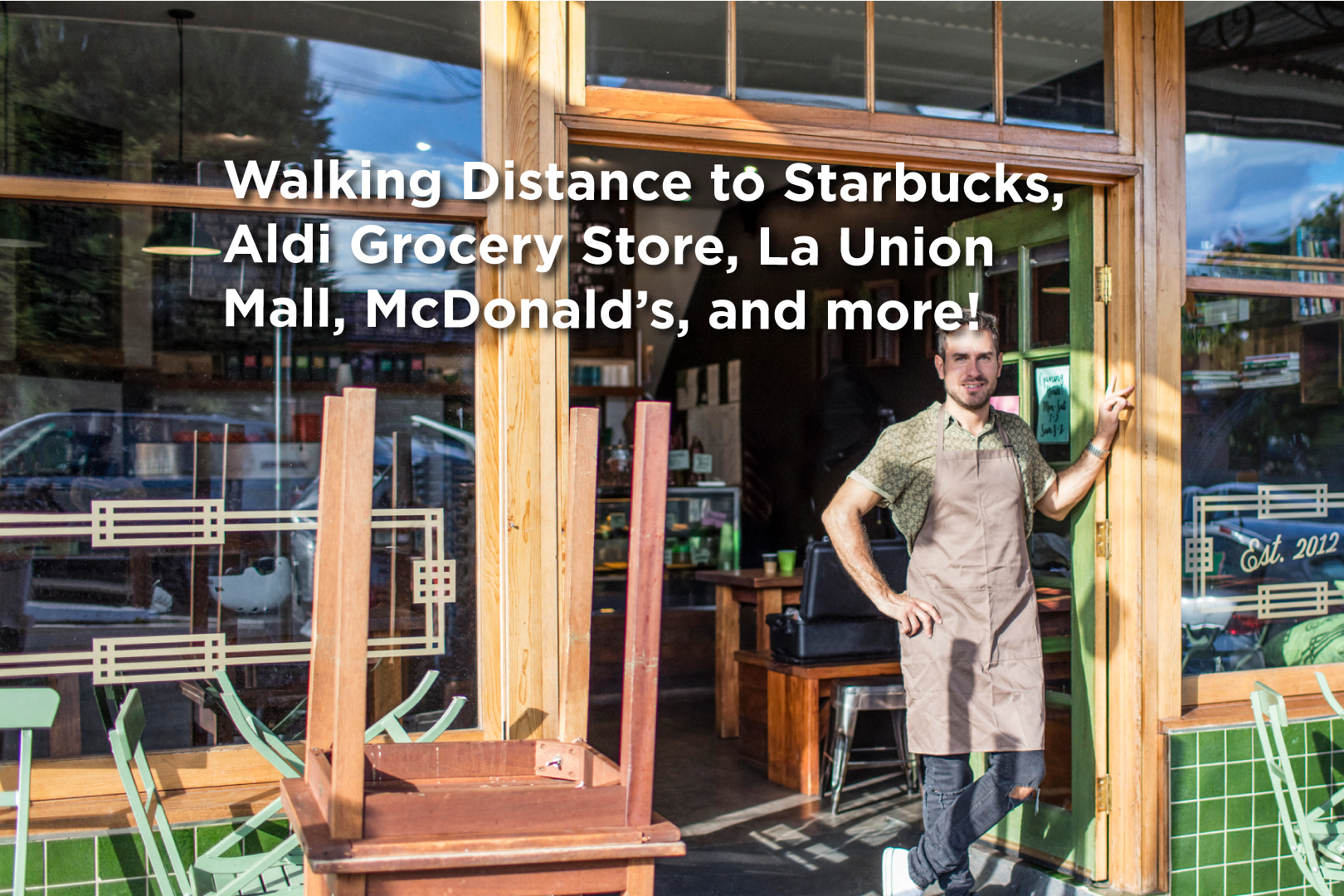 a man is standing in front of a glass door