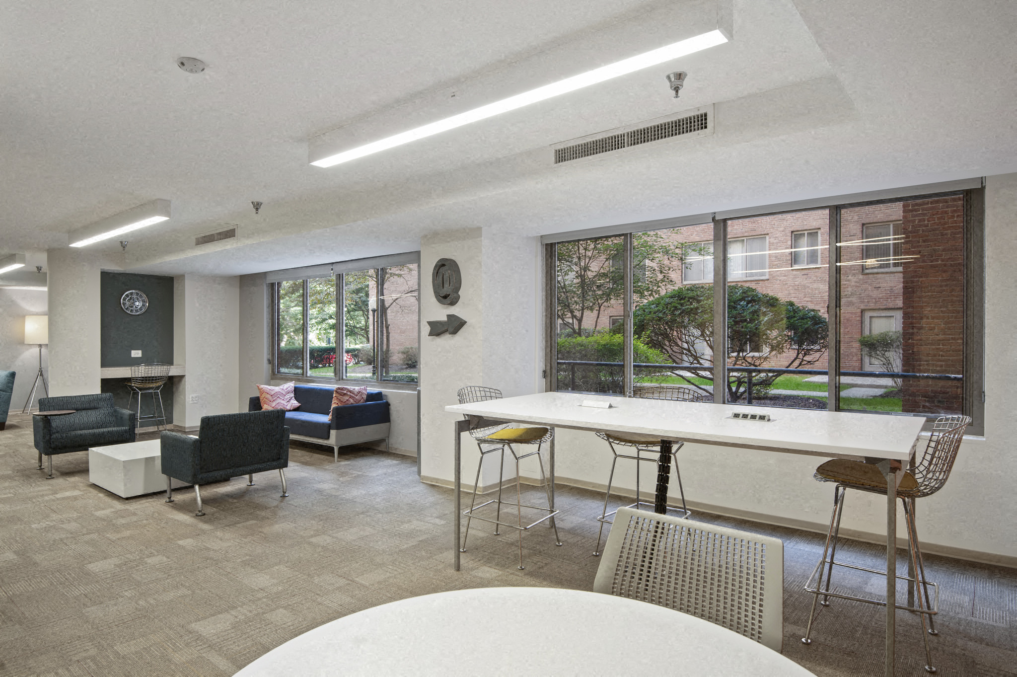 an open living room with a white table and chairs