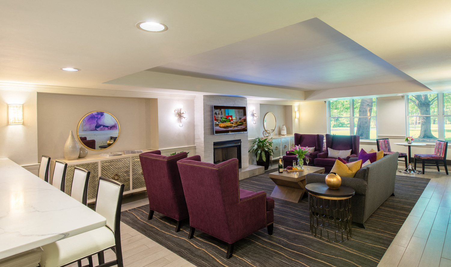 a living room with couches and chairs and a table