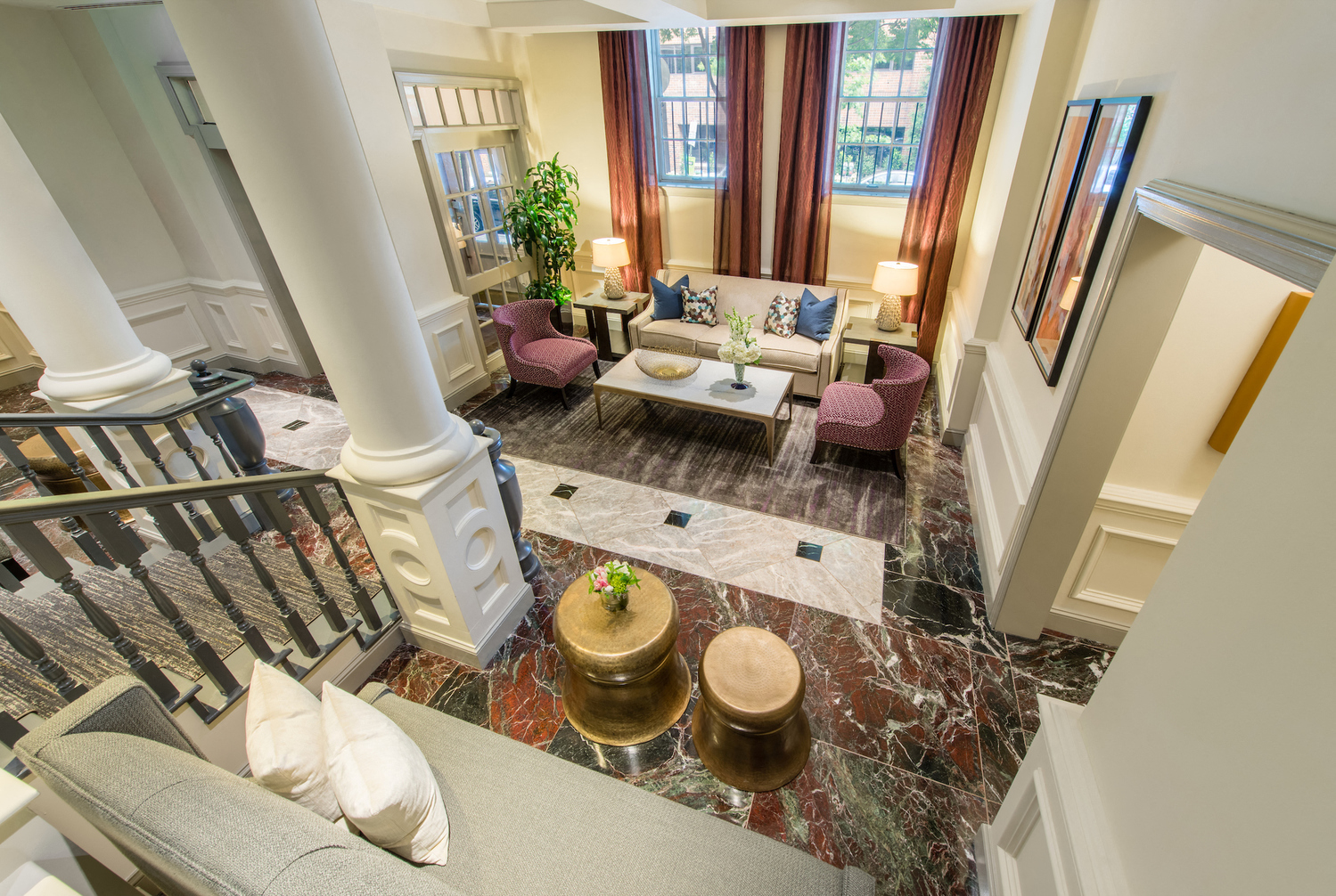 a view of a living room with couches and a table