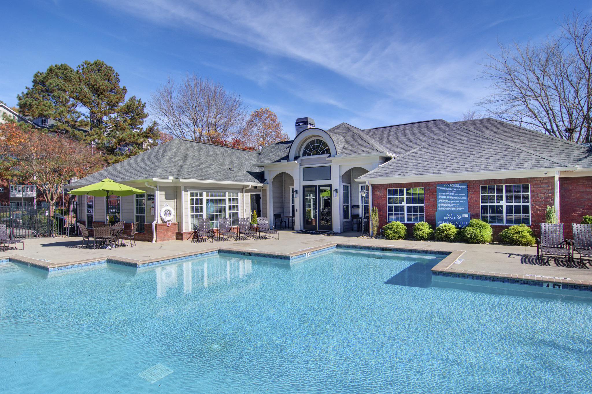 the preserve at ballantyne commons pool and club house with a large swimming pool