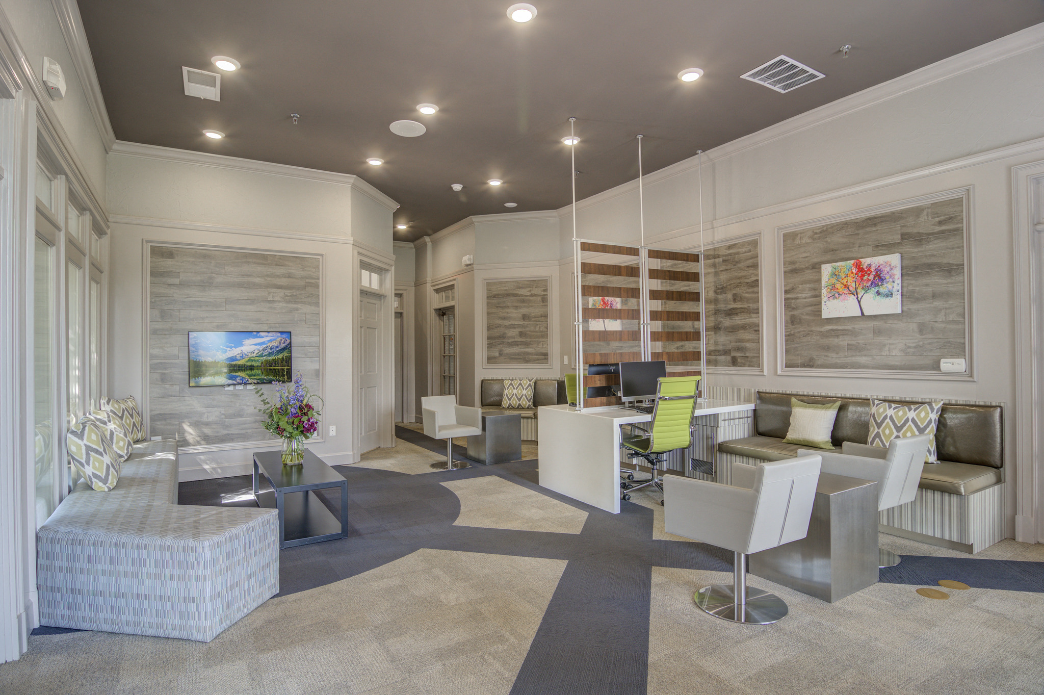a living room with couches and chairs and a television