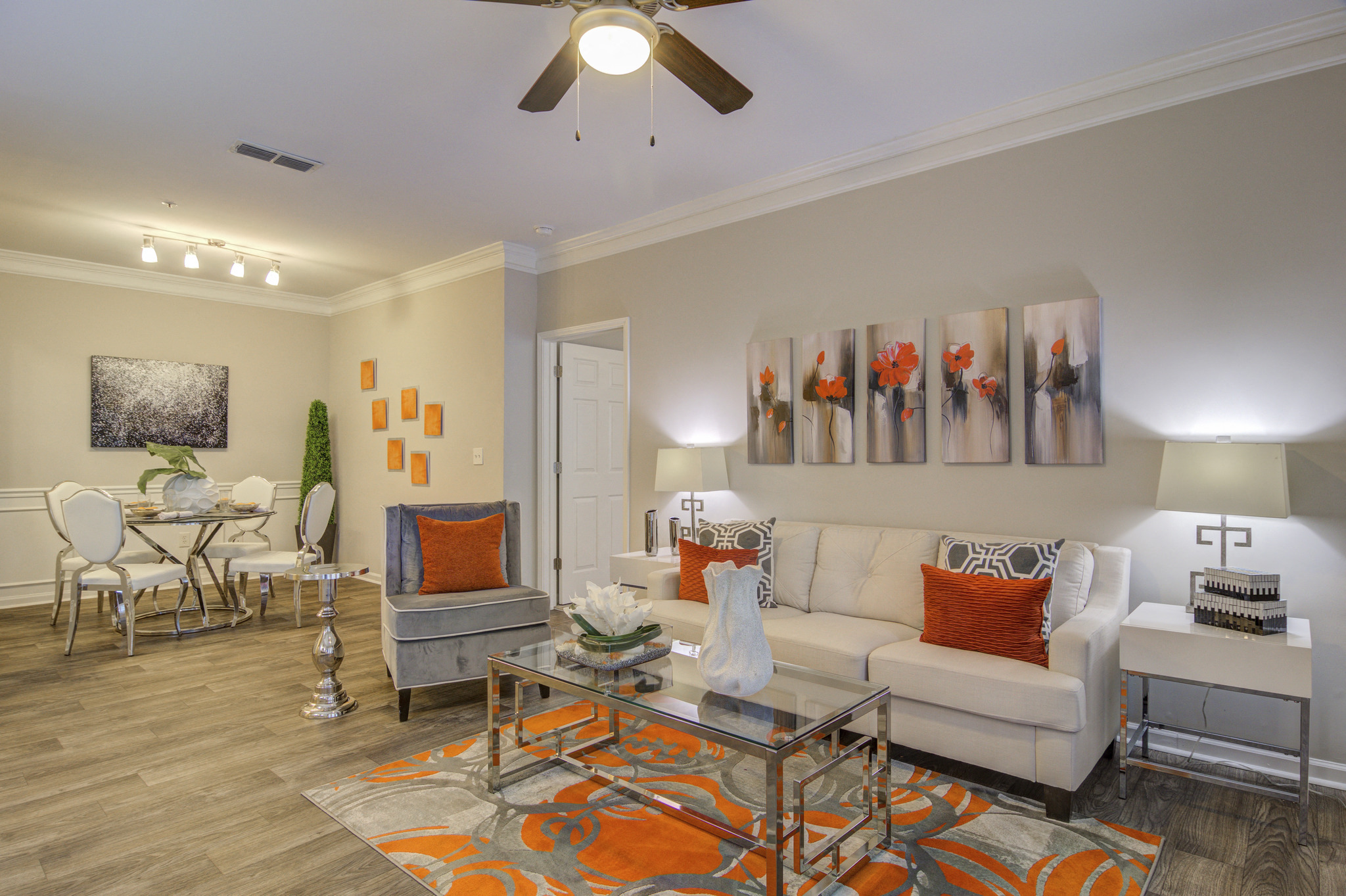 a living room with a couch and a glass table