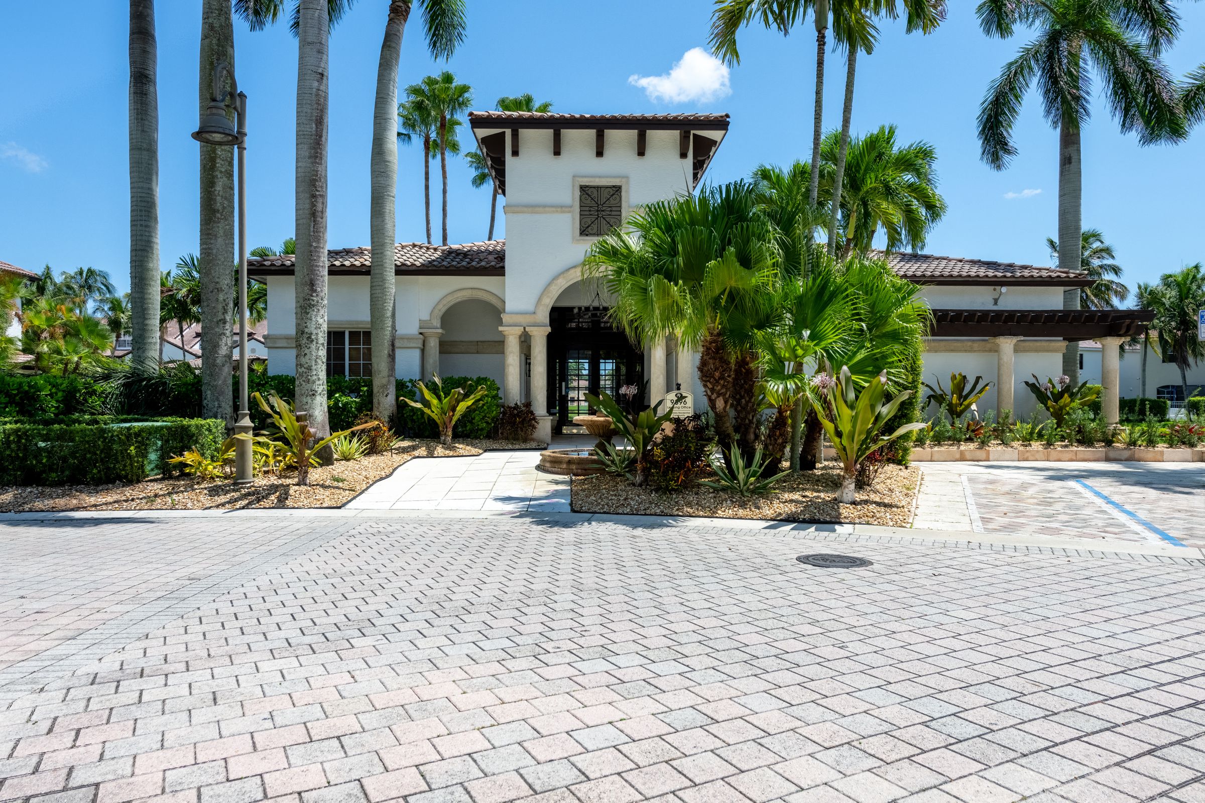 a house with palm trees in front of it
