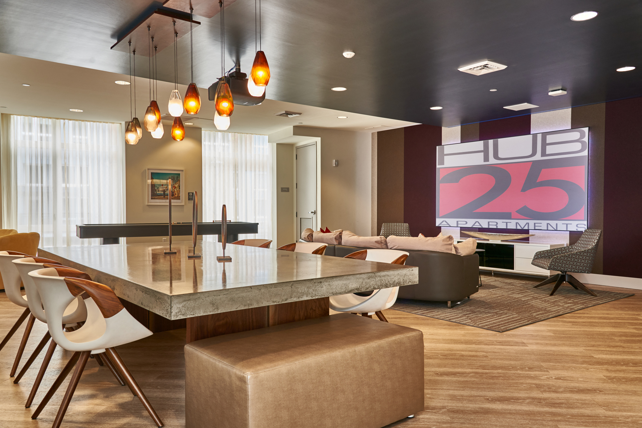 a dining room and living room with a table and chairs