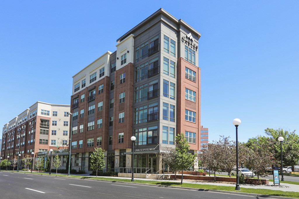 an apartment building on the corner of a street