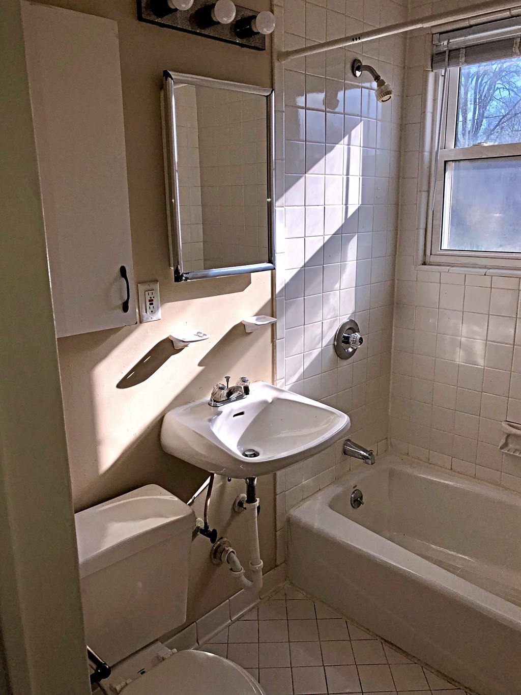 a bathroom with a sink and a toilet and a tub