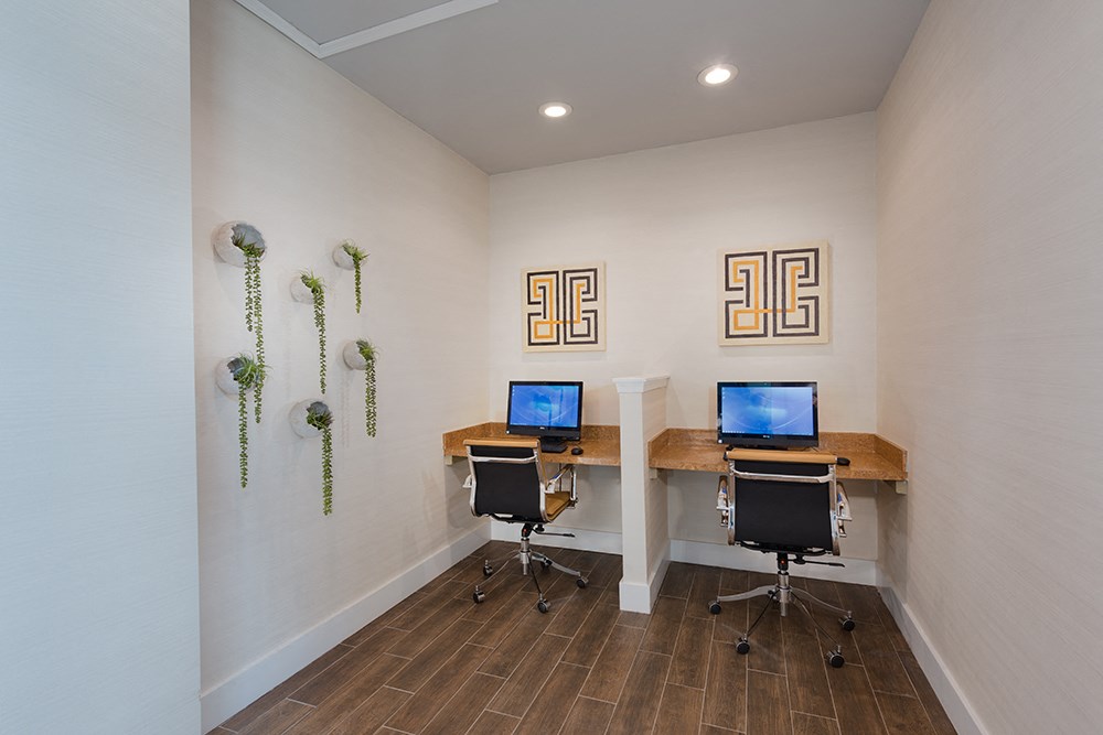 a home office with two desks and two computers