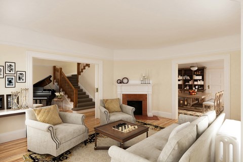 a living room with couches and a coffee table and a piano