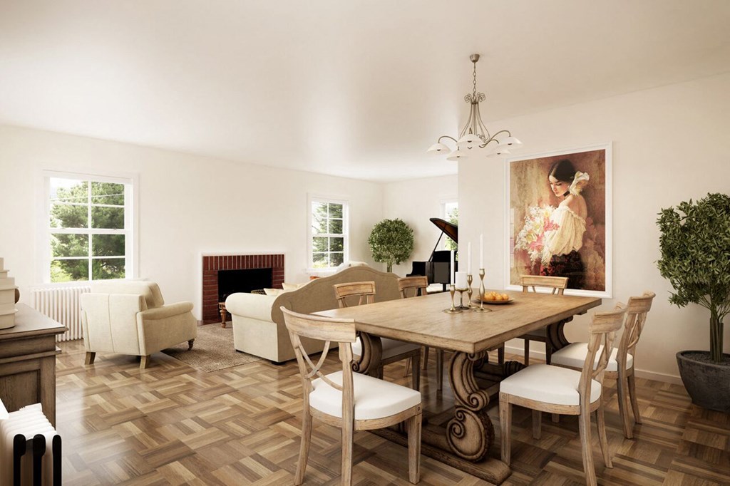 a living room and dining room with a table and chairs