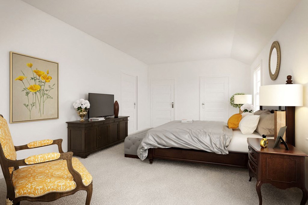 a bedroom with a bed and a dresser