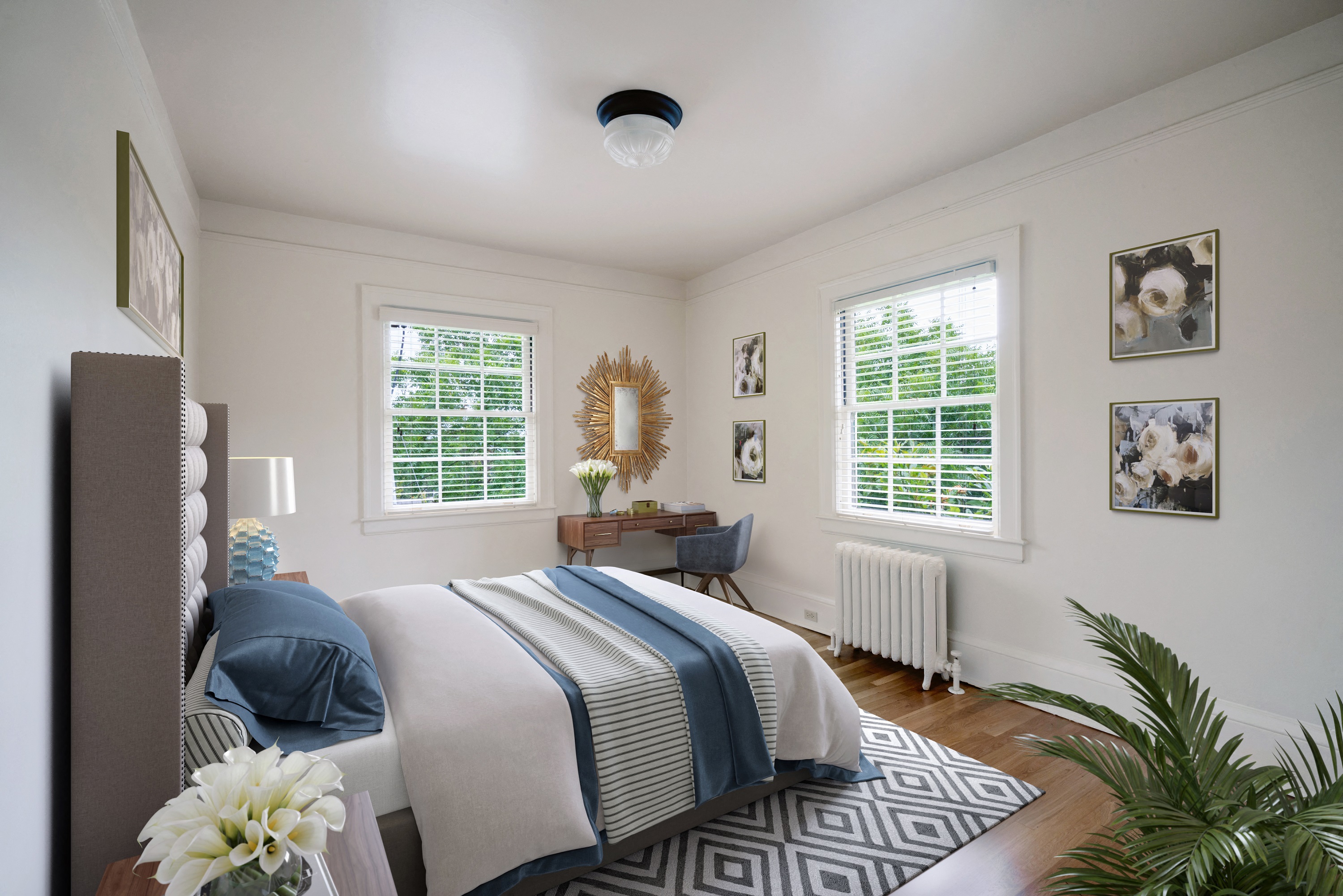 a bedroom with white walls and a bed with a blue and white comforter