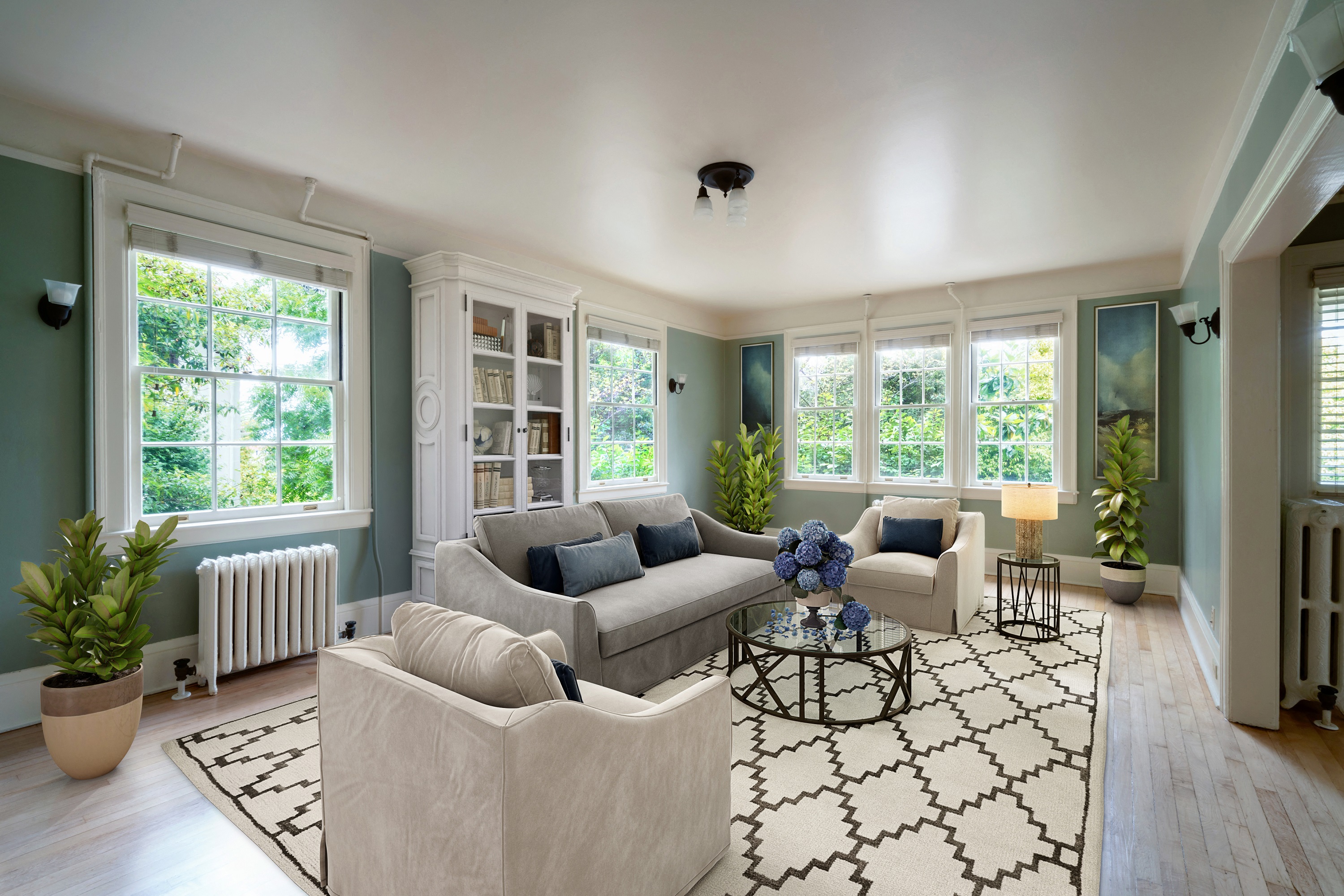 a living room with couches and chairs and a rug