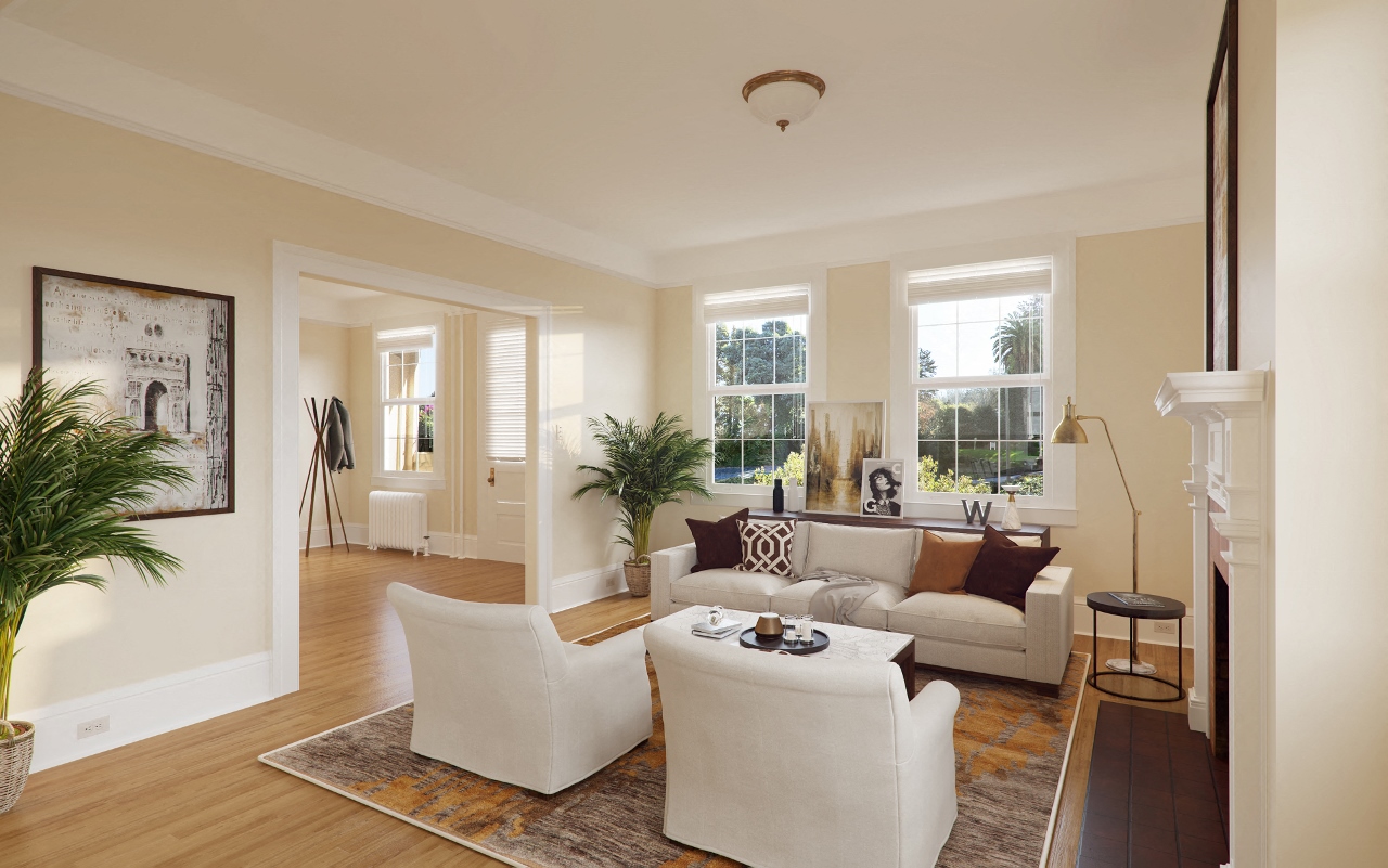 a living room with white furniture and a fireplace