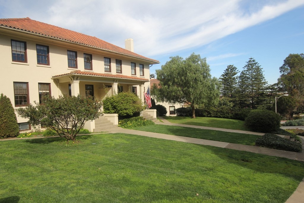 a large house with a lawn in front of it