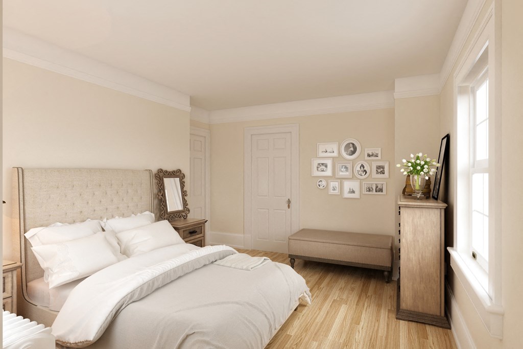 a bedroom with a bed and a dresser and a window