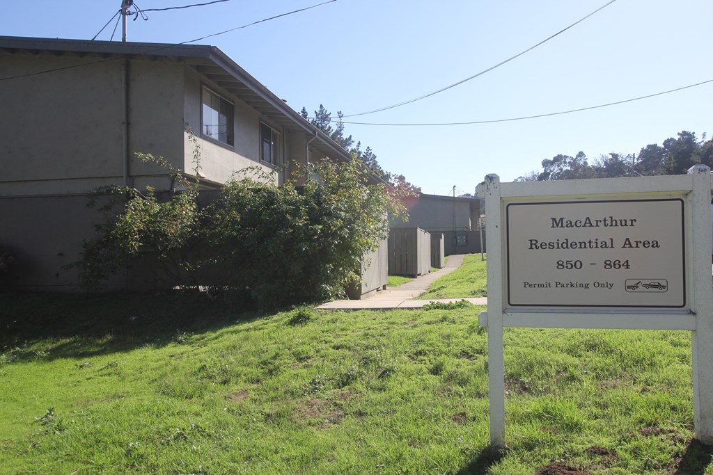 a sign for the macaulay residential area in front of a building