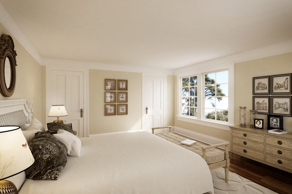 a bedroom with a large bed and a window