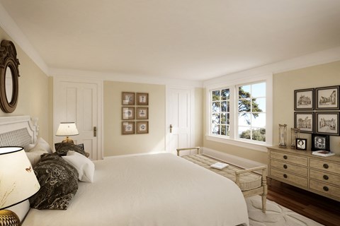 a bedroom with a large bed and a window