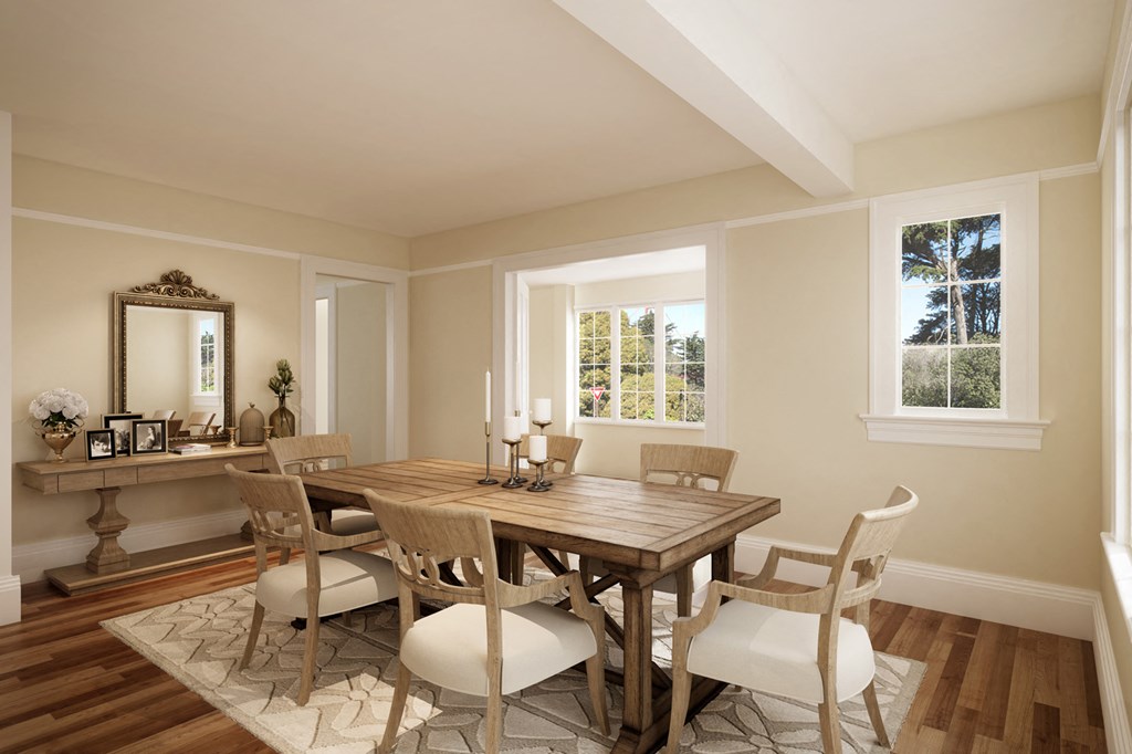 a dining room with a wooden table and chairs