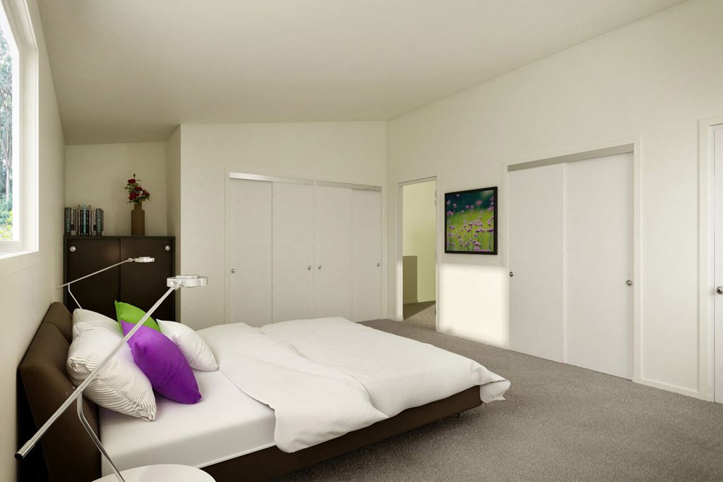 a bedroom with a bed and a dresser in it