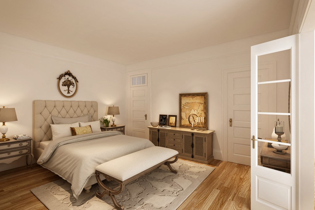 a bedroom with a bed and a dresser