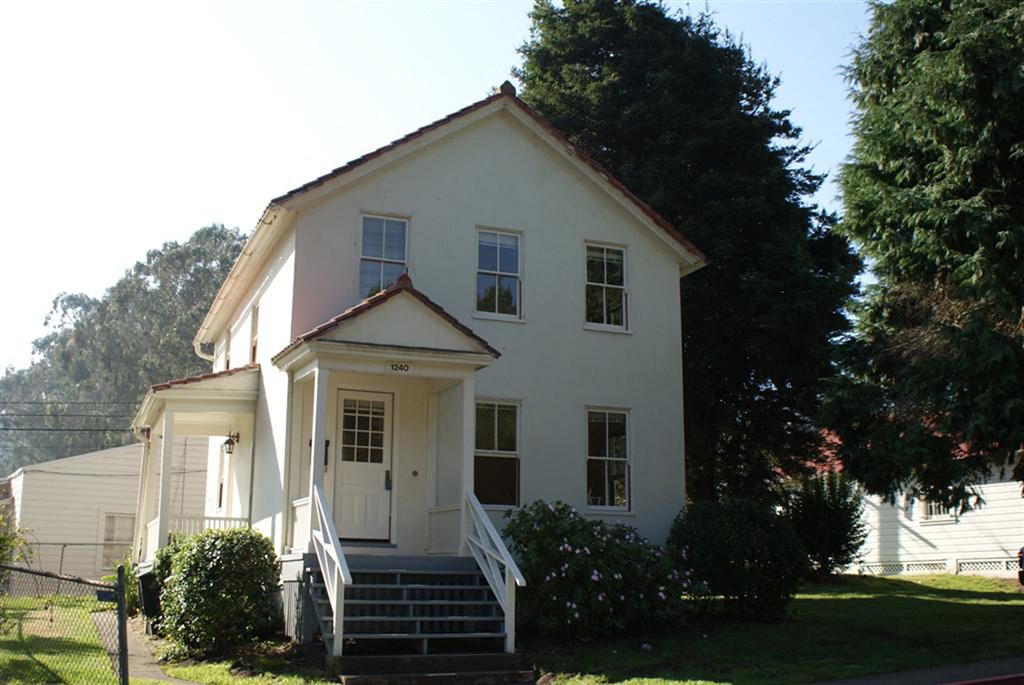 an old with a porch and stairs