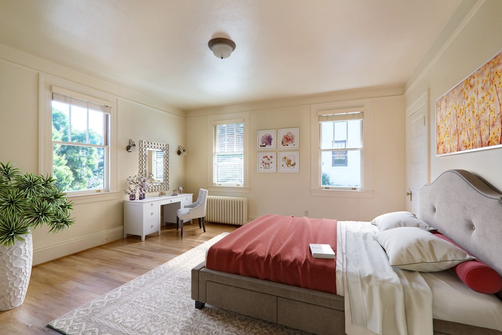 a bedroom with a bed and a desk