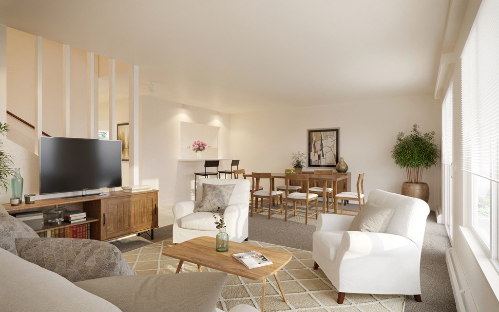 a living room and dining room with white furniture and a tv