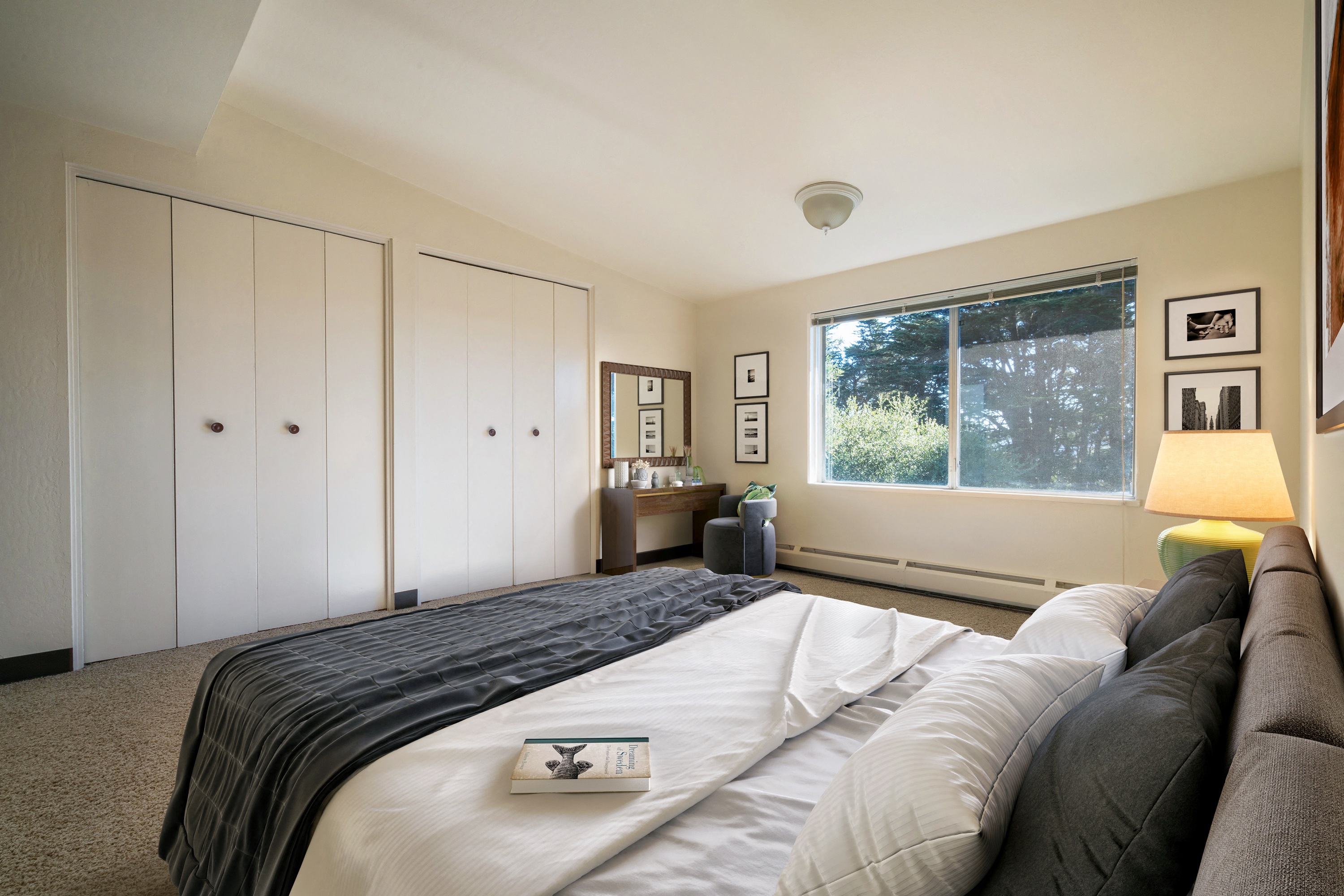 a bedroom with a large bed and a window