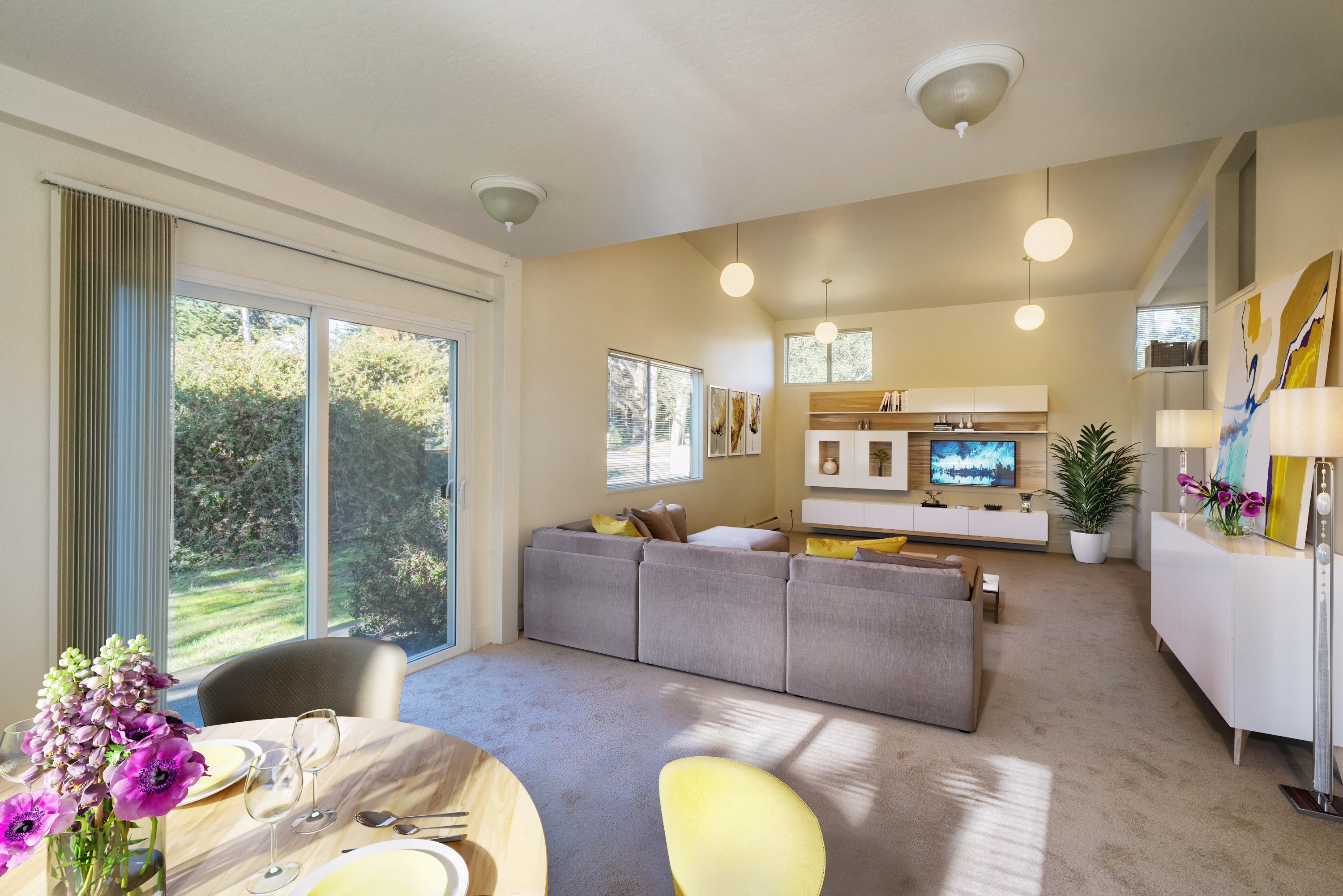 a living room and dining room with a couch and a table