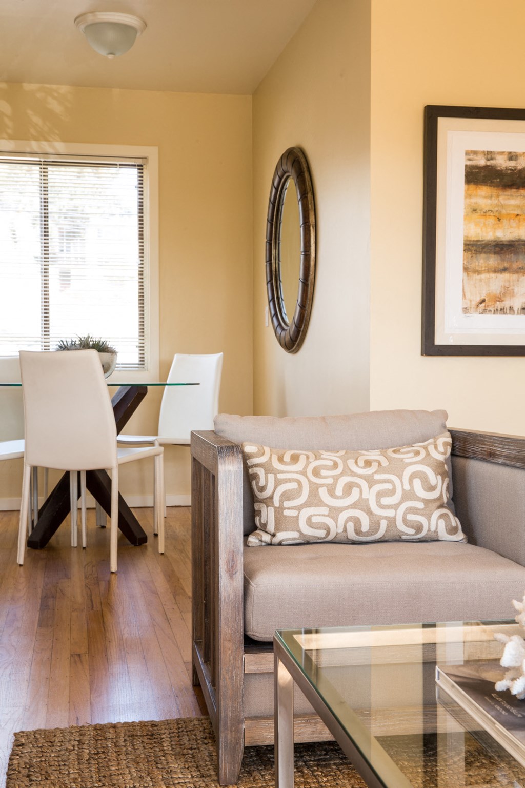 a living room with a couch and a dining room table