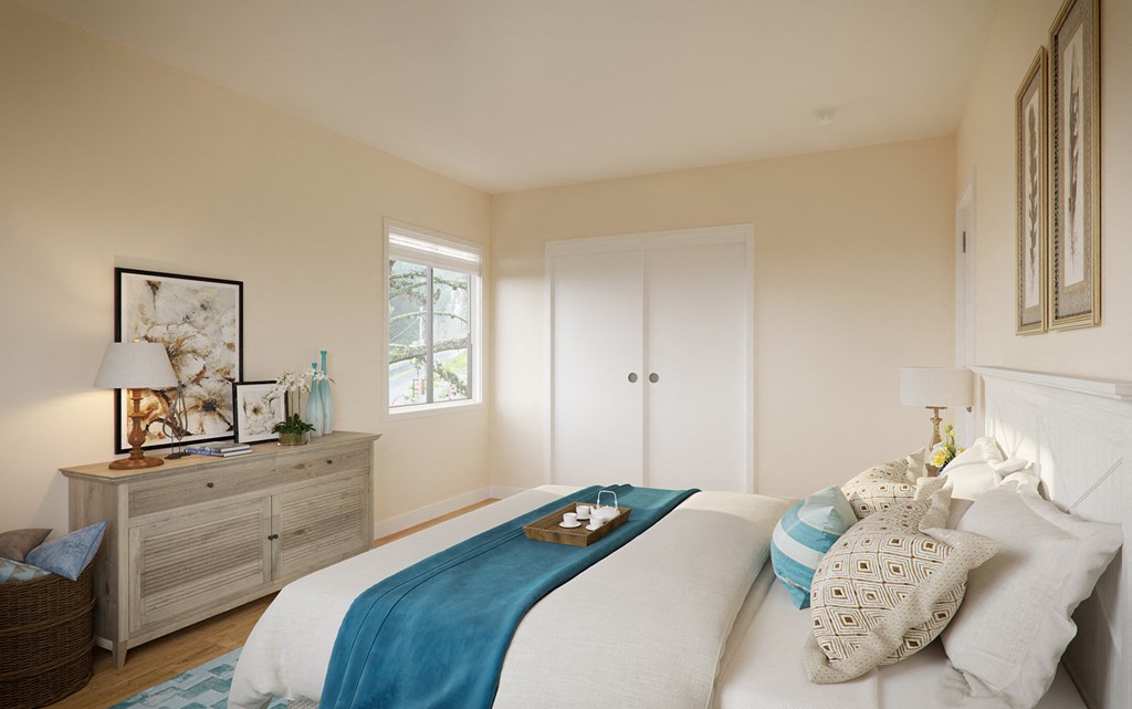 a bedroom with a bed and a dresser and a window