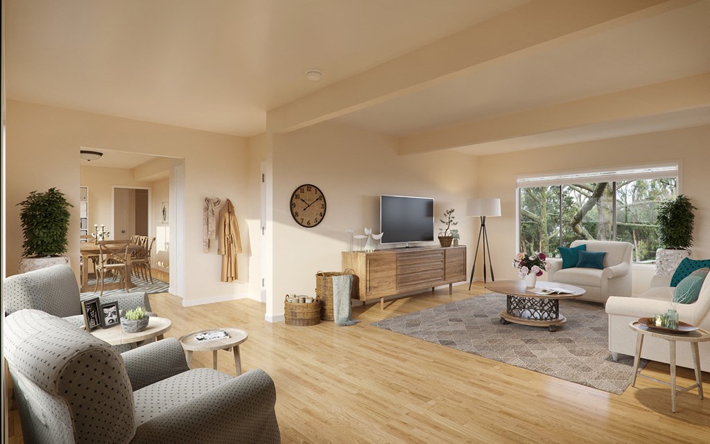 a living room with a couch and a chair and a television