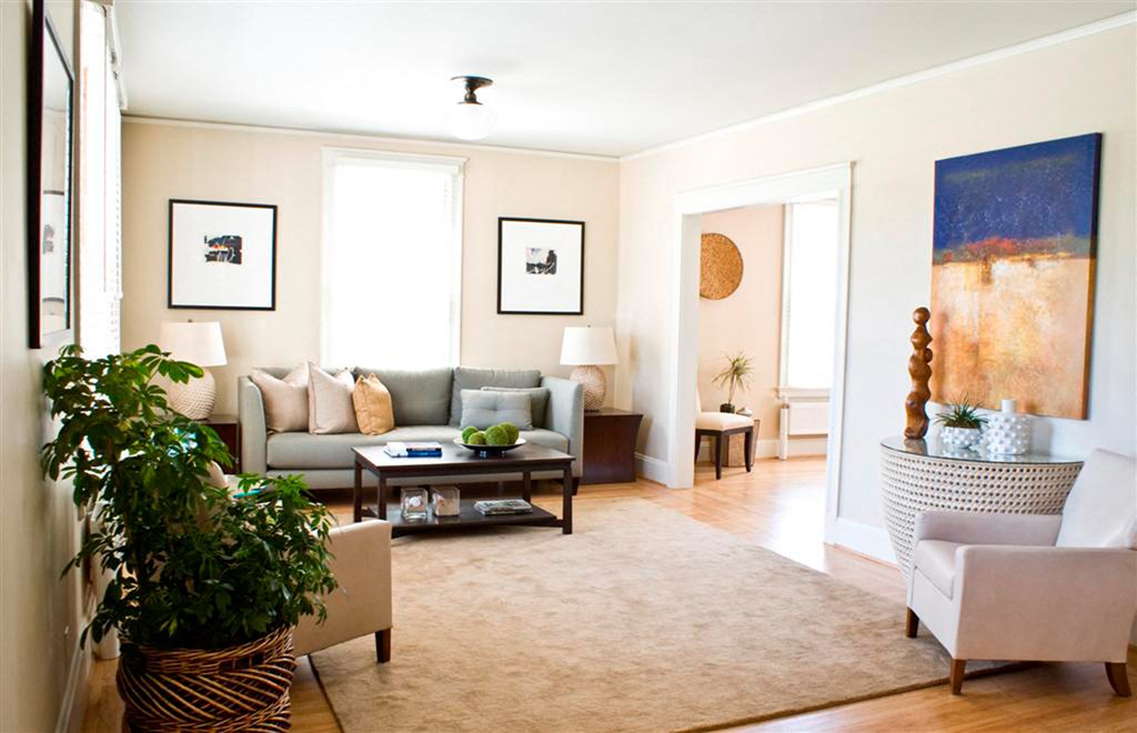 a living room filled with furniture and a rug