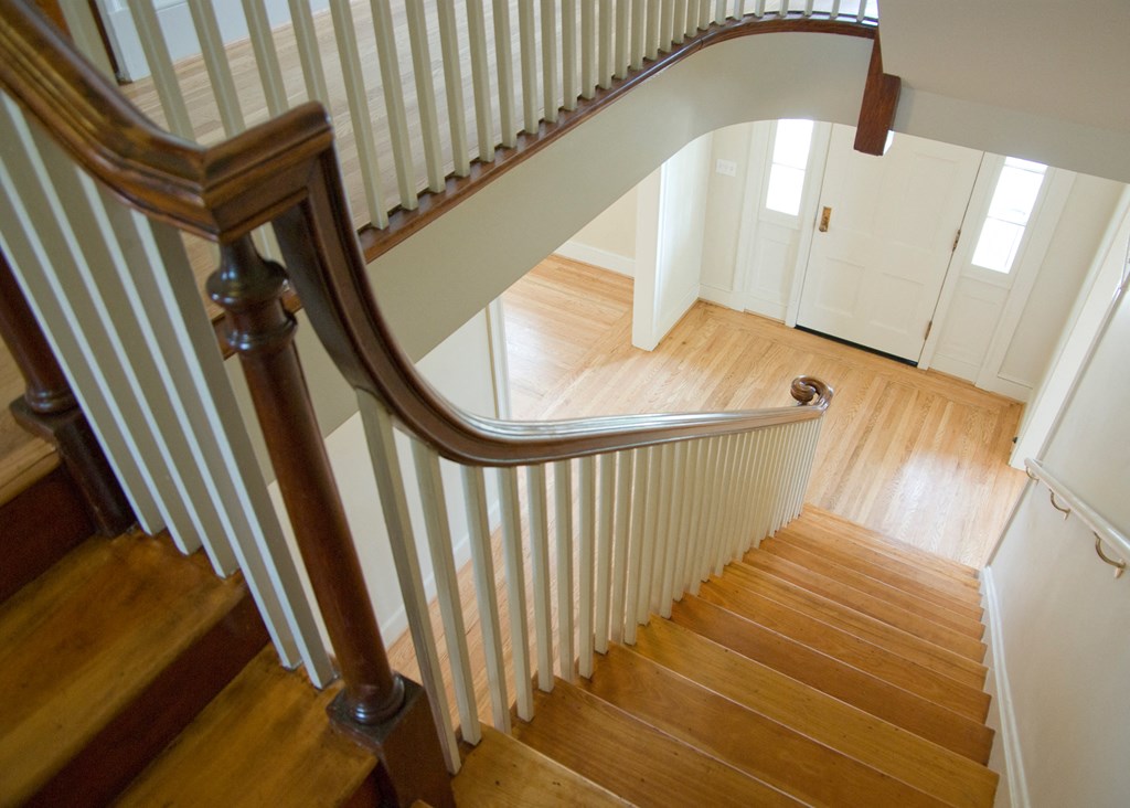 a view of a staircase from the top of it