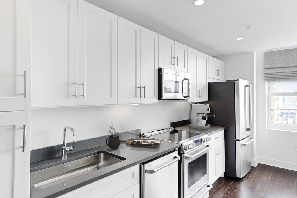 Kitchen with appliances at 65 Bay Street, Jersey City