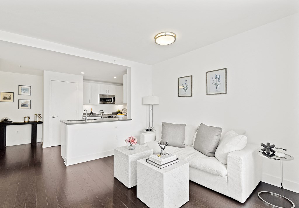 Living room with white couch at 65 Bay Street, Jersey City, NJ, 07302