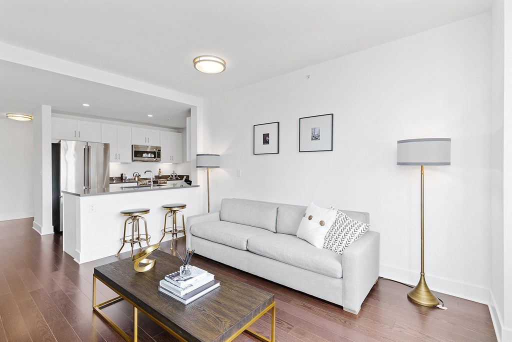 Living room with white couch and table at 65 Bay Street, Jersey City, 07302