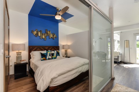 Bedroom With Ceiling Fan at Rivet Apartments, Seattle