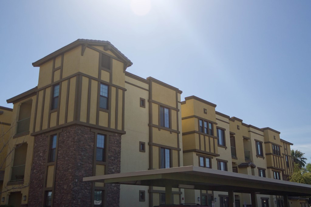 a large building with a blue sky in the background